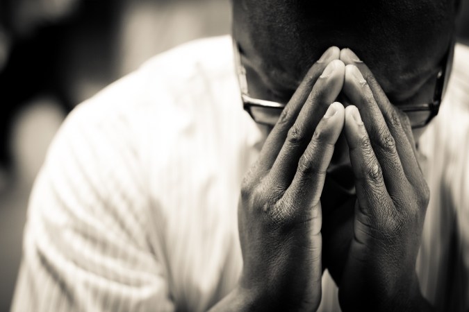 Man-In-Prayer-Christian-Stock-Photo